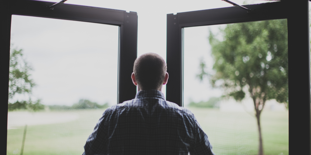 Person looking outside hoping to use mission statement for a ministry tool